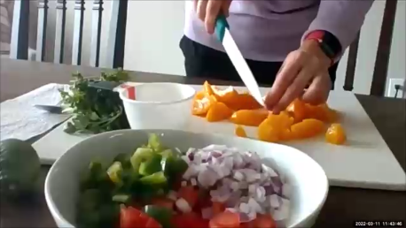 Nutritionist, Susan Newkirk, prepares peach salsa.