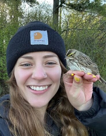 Claire Huff with a Savannah Sparrow at the Hudson Valley Farm Hub in Hurley, NY.