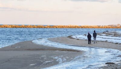 Walking along winter beach